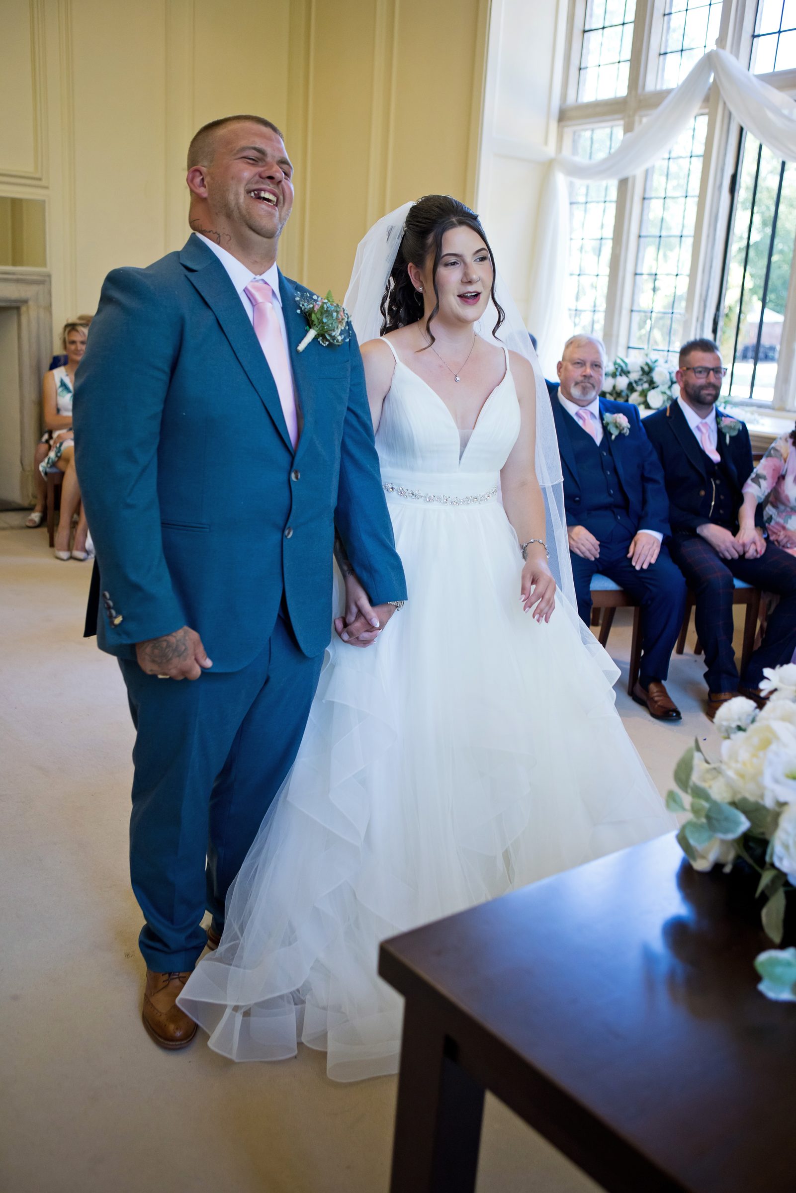 Melli and Ryan, just married, holding hands